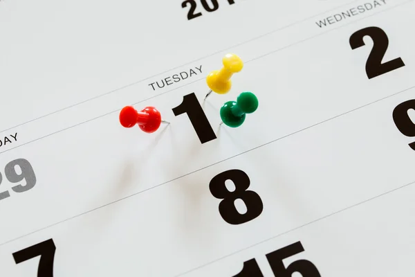 Pushpins on calendar, Busy and overworking days. Important date