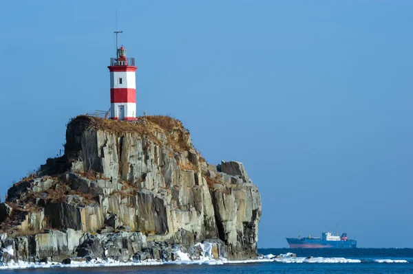 Lighthouse on a cliff by the sea. East (Japan) Sea.