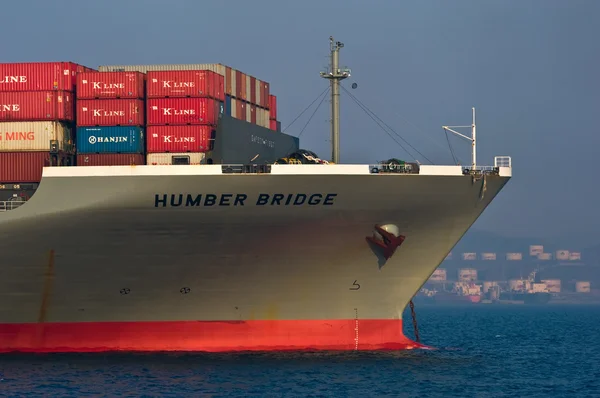 The bow of a huge container ship Humber Bridge anchored. Nakhodka Bay. East (Japan) Sea. 19.04.2014