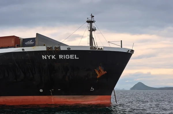 The bow of a huge container ship NYK Rigel anchored. Nakhodka Bay. East (Japan) Sea. 02.07.2015