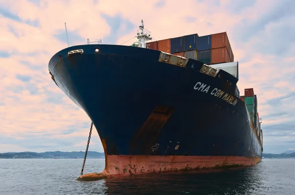Nakhodka, Russia- 02.08.2015: Container ship CMA CGM Marlin standing on the roads at anchor. Nakhodka Bay. East (Japan) Sea. 02.08.2015
