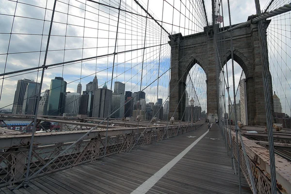 Brooklyn bridge with people cycling Manhattan Ney York