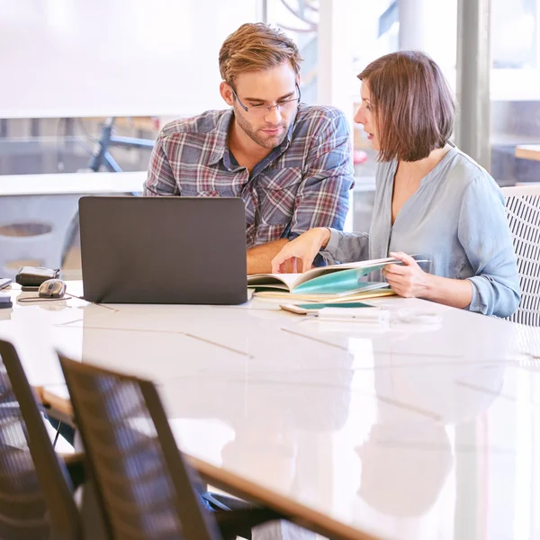 Meeting between businessman and businesswoman early in the morning