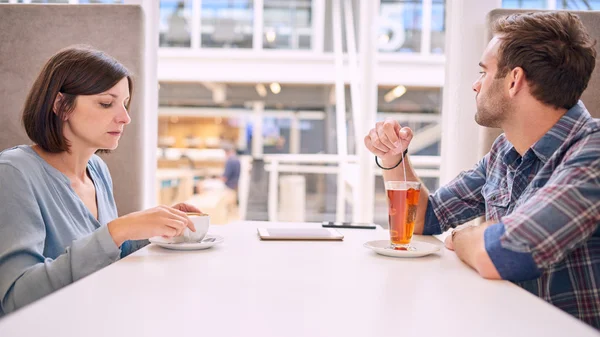 Heterosexual couple showing no interest towards each other