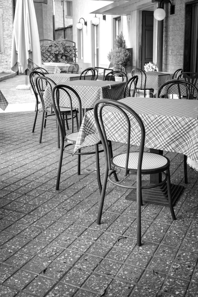 Tables and chairs. Black and white photo