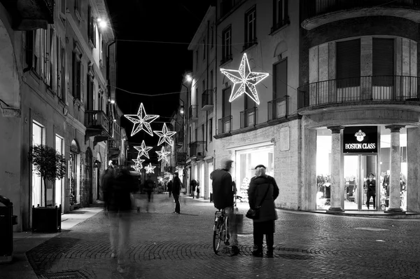 Vigevano, Pavia (Lombardy, Northern Italy): old city view during Christmas time. Black and white photo.