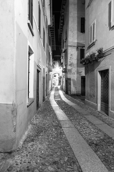 Orta San Giulio old city, night view. Black and white photo