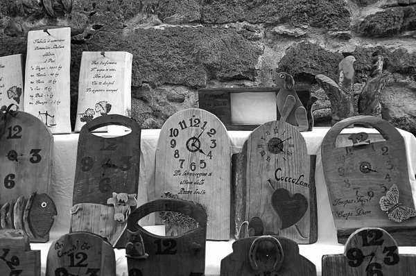 Artistic wooden clocks. Black and white photo