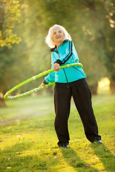 Senior Woman doing Exercises in Nature