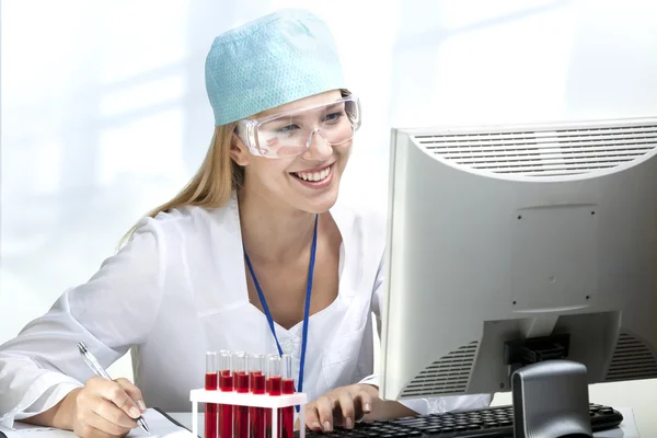 Young Woman Scientist Working in Laboratory