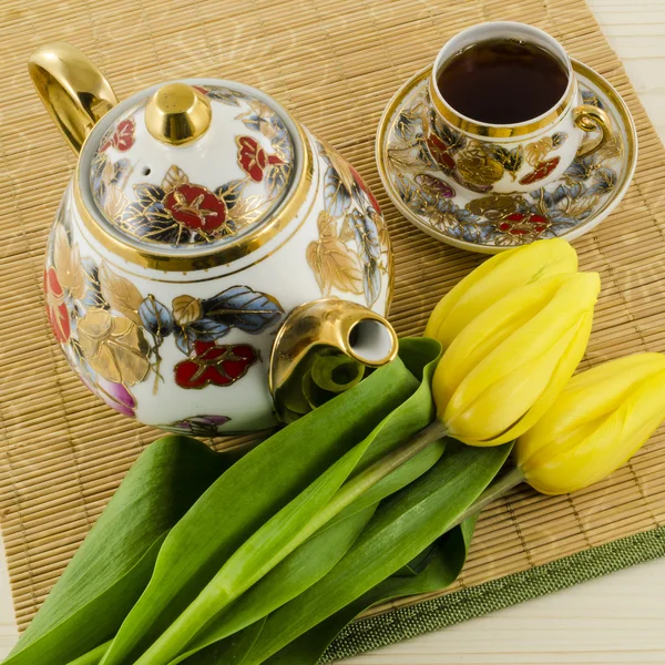 Porcelain coffee set with yellow tulip flowers