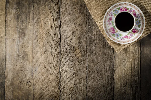 Porcelain coffee cup on wooden table