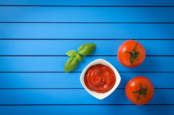 Tomato puree on wooden table