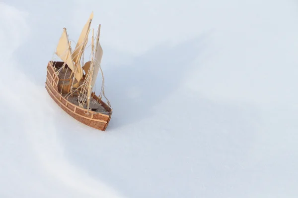 The toy ship on snow