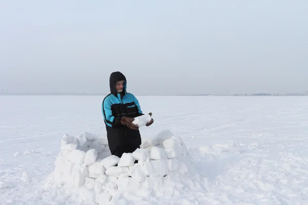 The man building a igloo