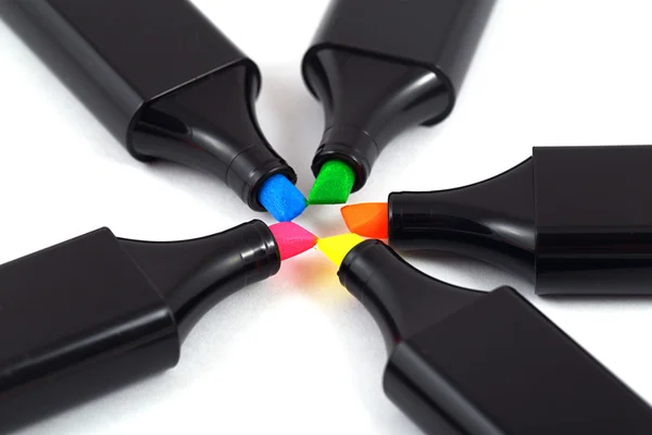 Five colored markers in a black casing with colored bars.
