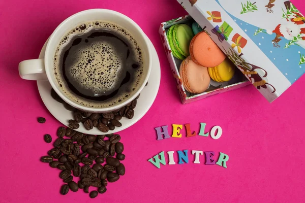 Tag hello winter, cup of coffee with macaroons