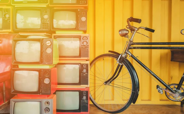 Bicycle and old TV on the retro.