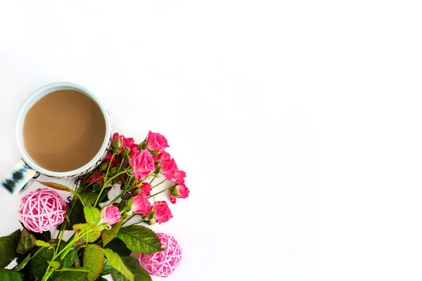 Roses and coffee on white background