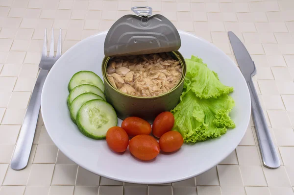 Canned tuna serve on dish with salad