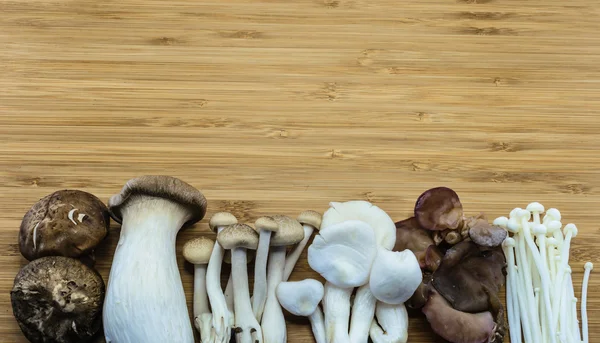 Oriental mixed mushroom on wood background