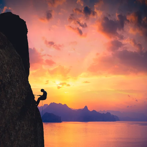 Climber against sunset