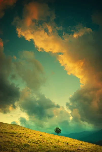 Colorful clouds above the valley. Vintage colors