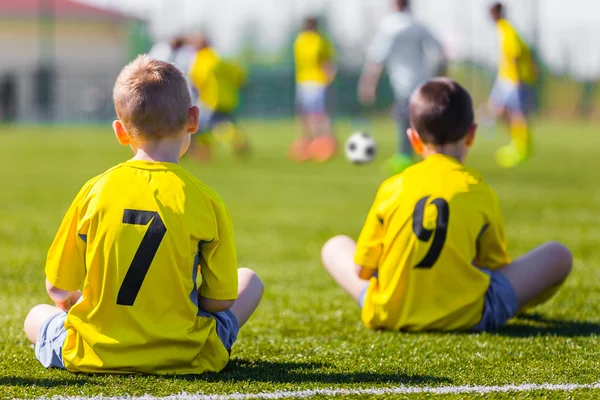 Young football team wearing sports yellow soccer dress. Soccer p