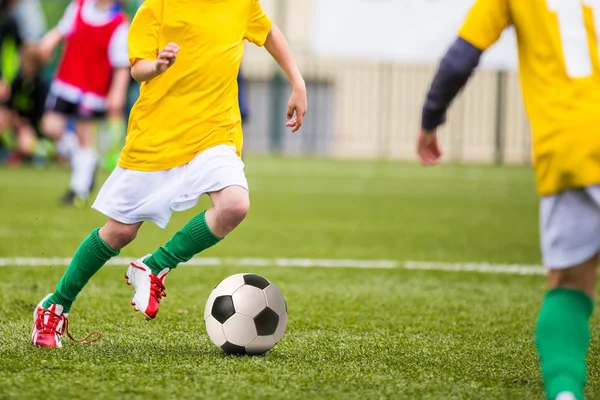 Football match for children. Boys training and football soccer tournament