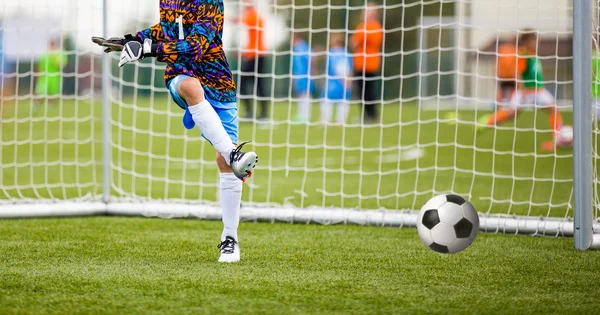 Soccer goalkeeper kicking ball