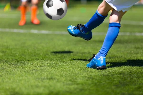 Football soccer player kick a soccer ball