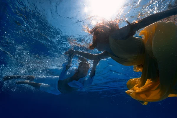 Man and woman underwater