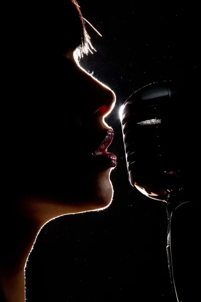 Singer woman with microphone