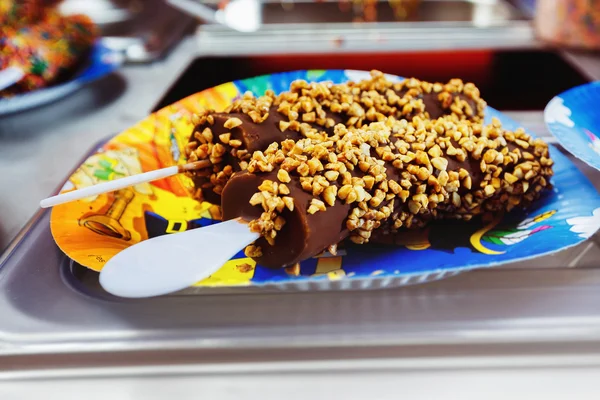 Tasty bananas covered by chocolate and nuts for a holiday lunch.