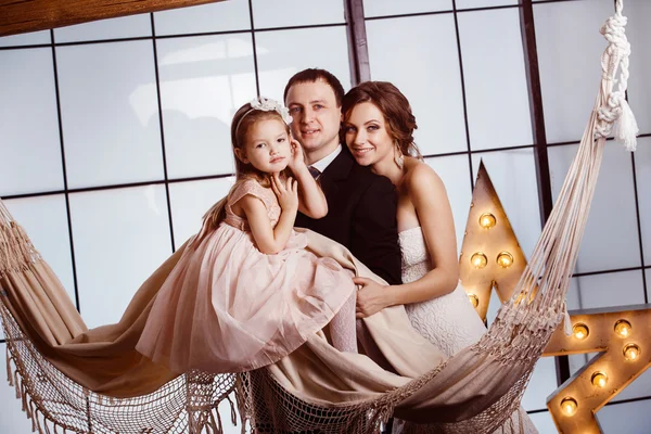 A happy family concept. Beautiful pregnant wife in wedding dress
