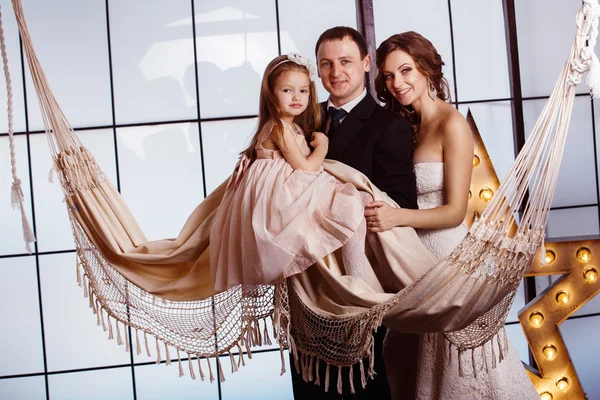 A happy family concept. Beautiful pregnant wife in wedding dress