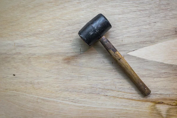 Rubber mallet on wooden surface