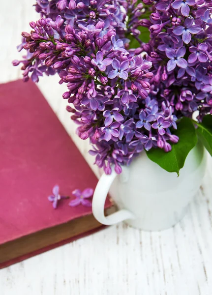 Lilac flowers and old book