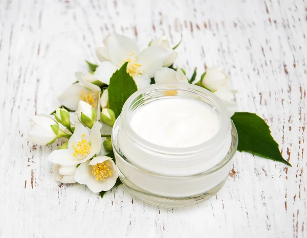 Face and body cream moisturizers with jasmine flowers