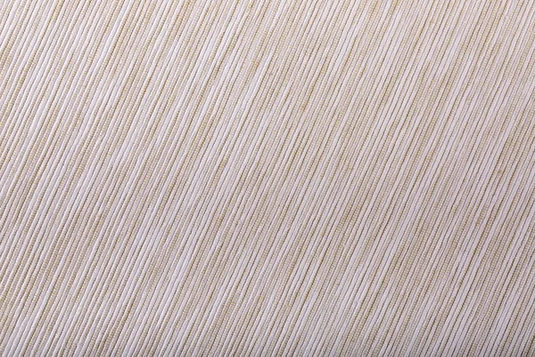 Beige diagonal striped fabric texture. Cloth background.