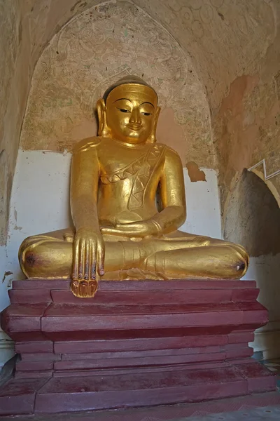 Buddha statue into the temple. Bagan, Myanmar (Burma)