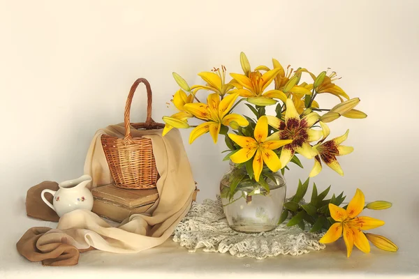 Still life with lilies in a vase with water.