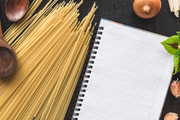 The blank recipe book with italian spaghetti