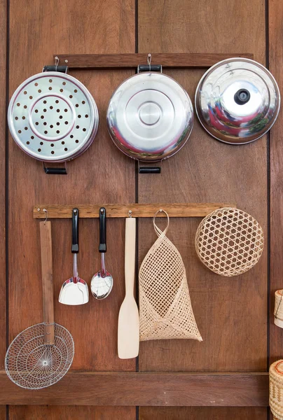 Old style kitchenware in Thailand on wood wall