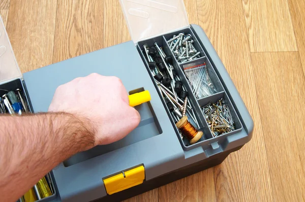 Box with a set of household tools