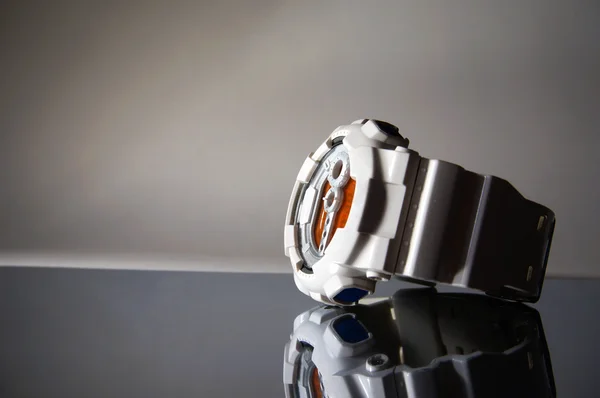 Stylish digital watch in shadows
