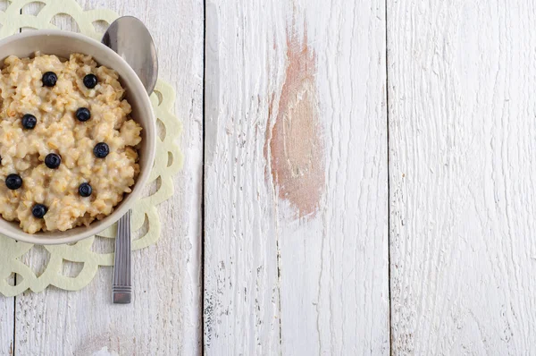 Oatmeal porridge for breakfast, top view