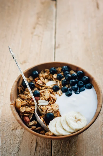 Homemade oatmeal granola with peanuts, blueberry and banana