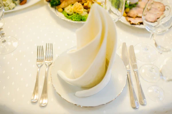 Table setting with plate, spoon, fork and knife