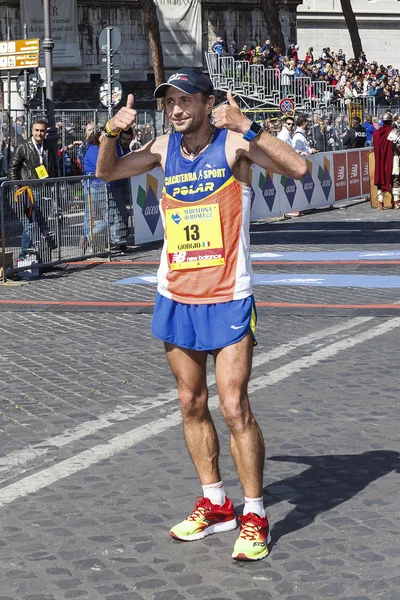 Giorgio Calcaterra pose at the Marathon finish line in Rome in 2